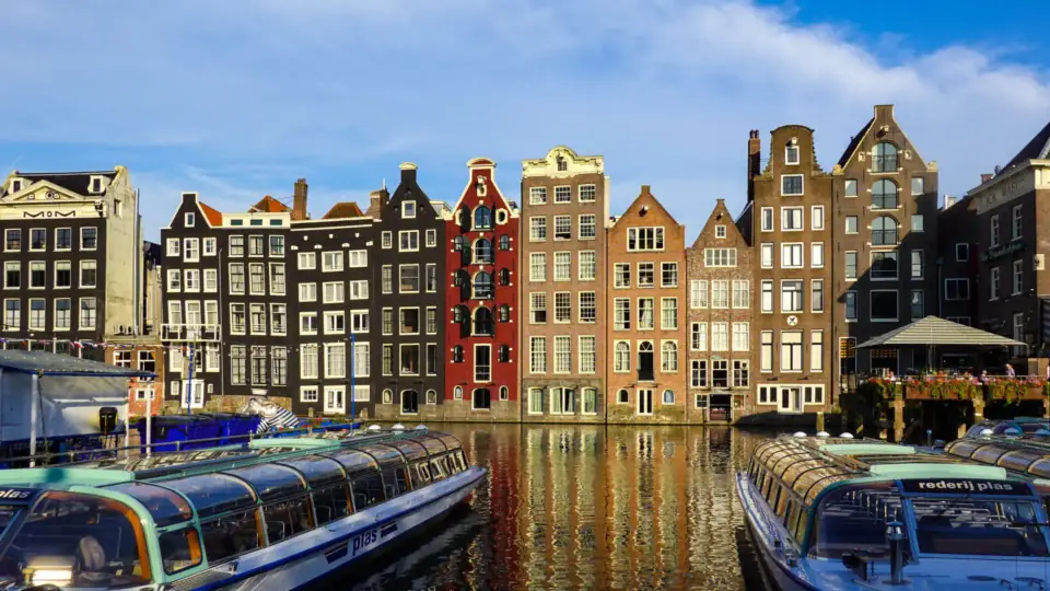 Canal houses and tour boats in central Amsterdam