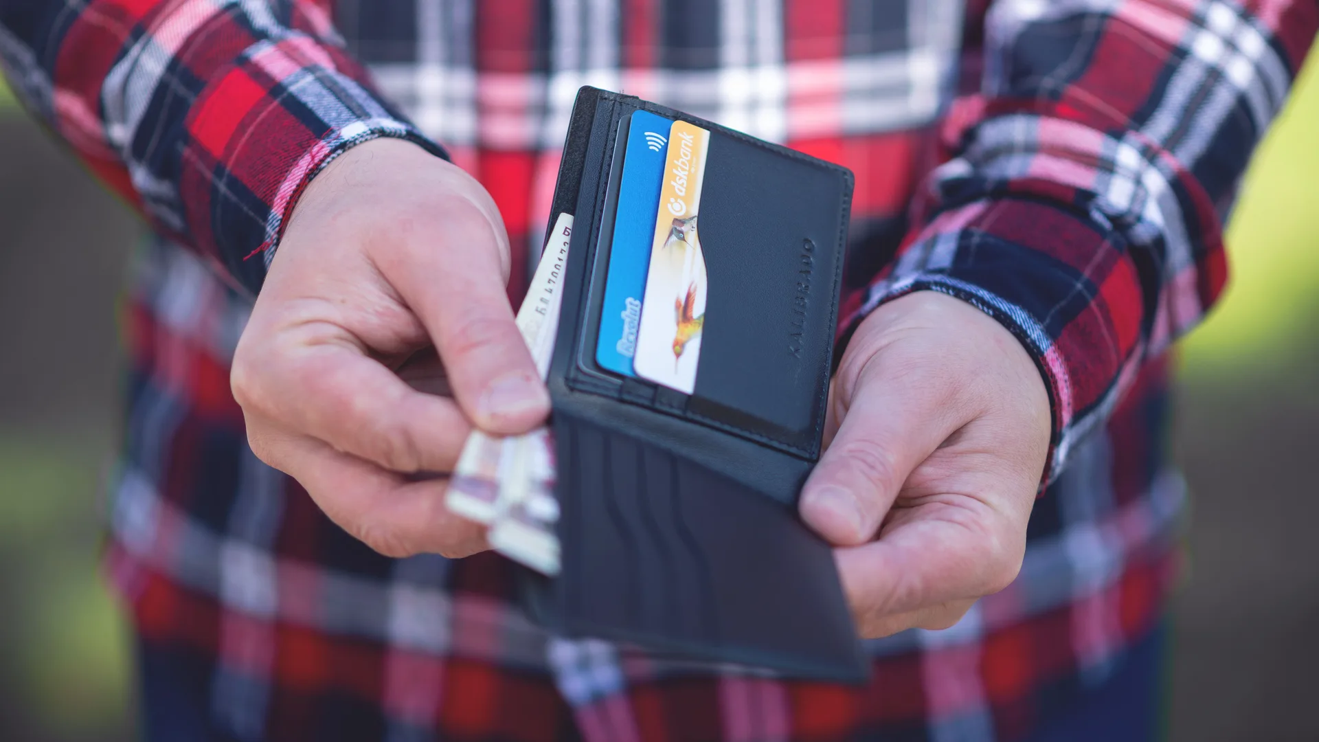 An open wallet showing loyalty and payment cards