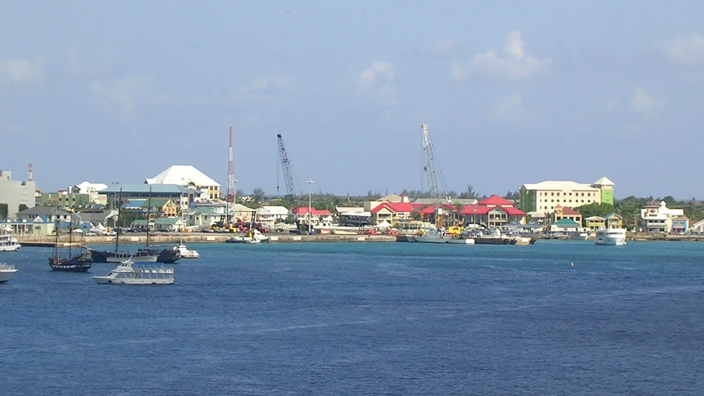 George Town harbor seen from a cruise ship at anchor, with tender boats working the waterfront