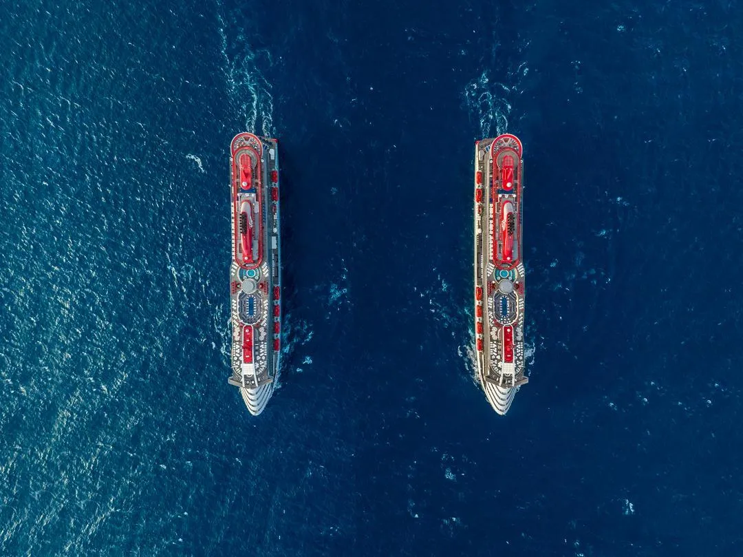 Scarlet Lady at sea — the best moment to run your Virgin Voyages MNVV Sailor Loot stack math before visiting Sailor Services
