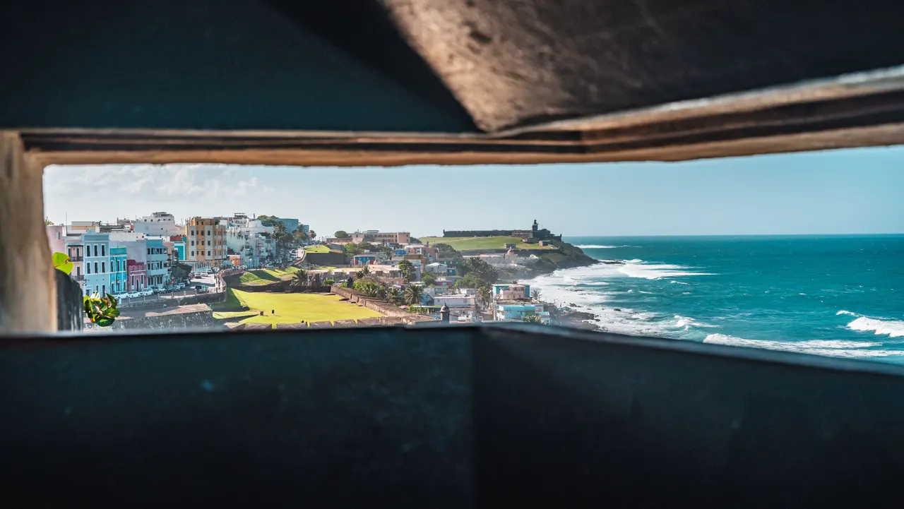 Scenic view of San Juan’s coastal cityscape through fortifications.