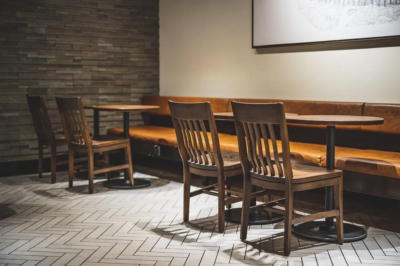 Cozy counter and booth seating in a warm, low-lit restaurant corner