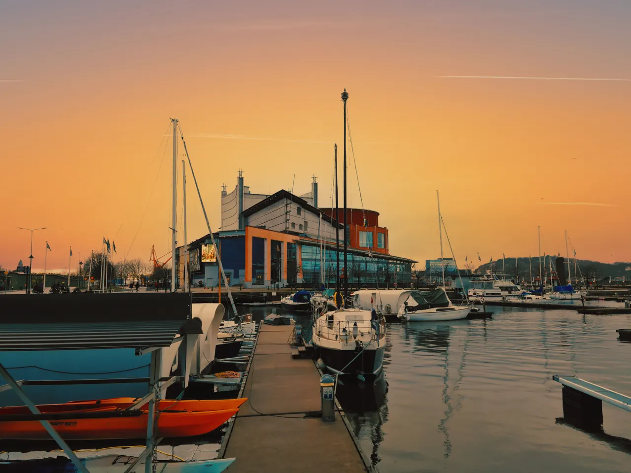 Scenic sunset view with boats docked at Nordstaden Marina, Västra Götalands, Sweden.