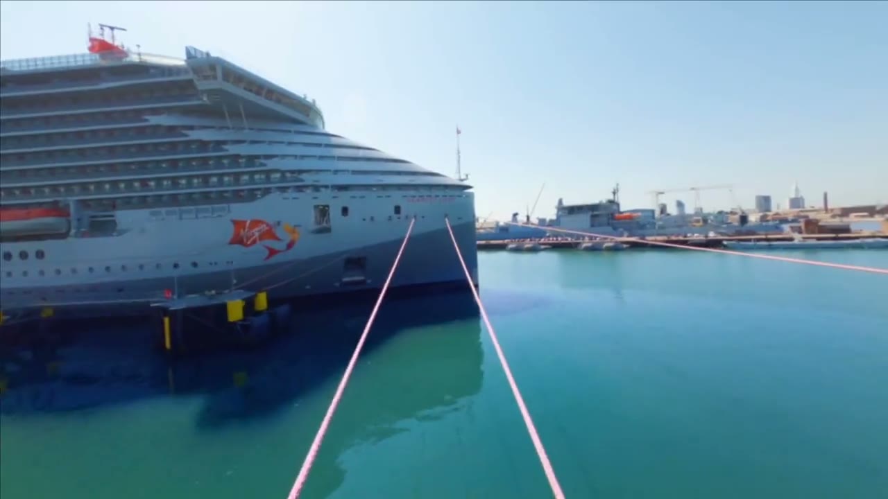 Aerial view of a Virgin Voyages ship at port — adults-only cruises with Military, First Responder and Resident rates